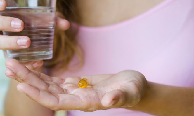 woman taking vitamins