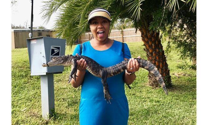woman holding a baby alligator at Black Hammock Adventures Airboat Ride in Florida