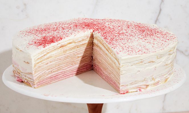 raspberry crepe cake on stand