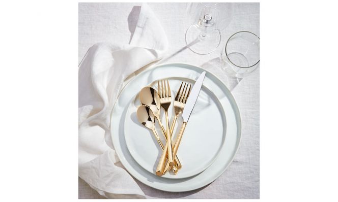 white plates with gold flatware