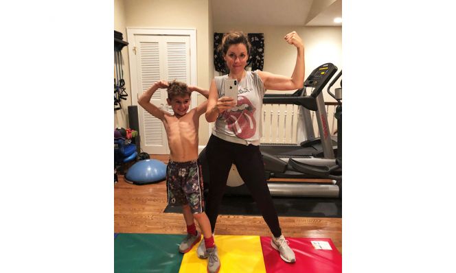 Amy Ruggiero, after her weight loss, works out with her son
